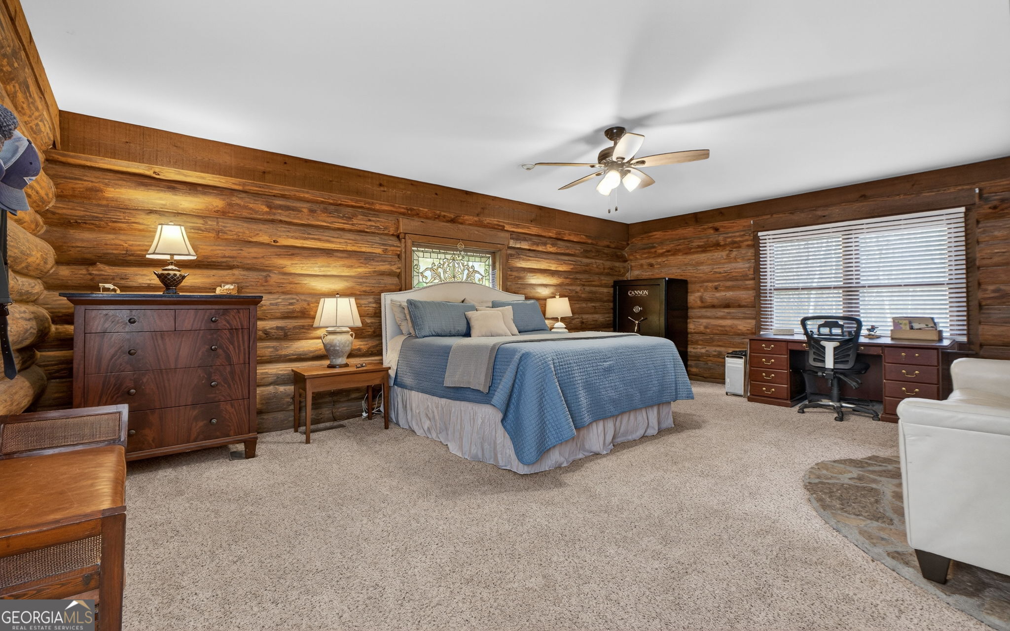 261 McIntosh Circle Jackson, GA 30233 - Photo 34 of 77 a bedroom with furniture and a chandelier