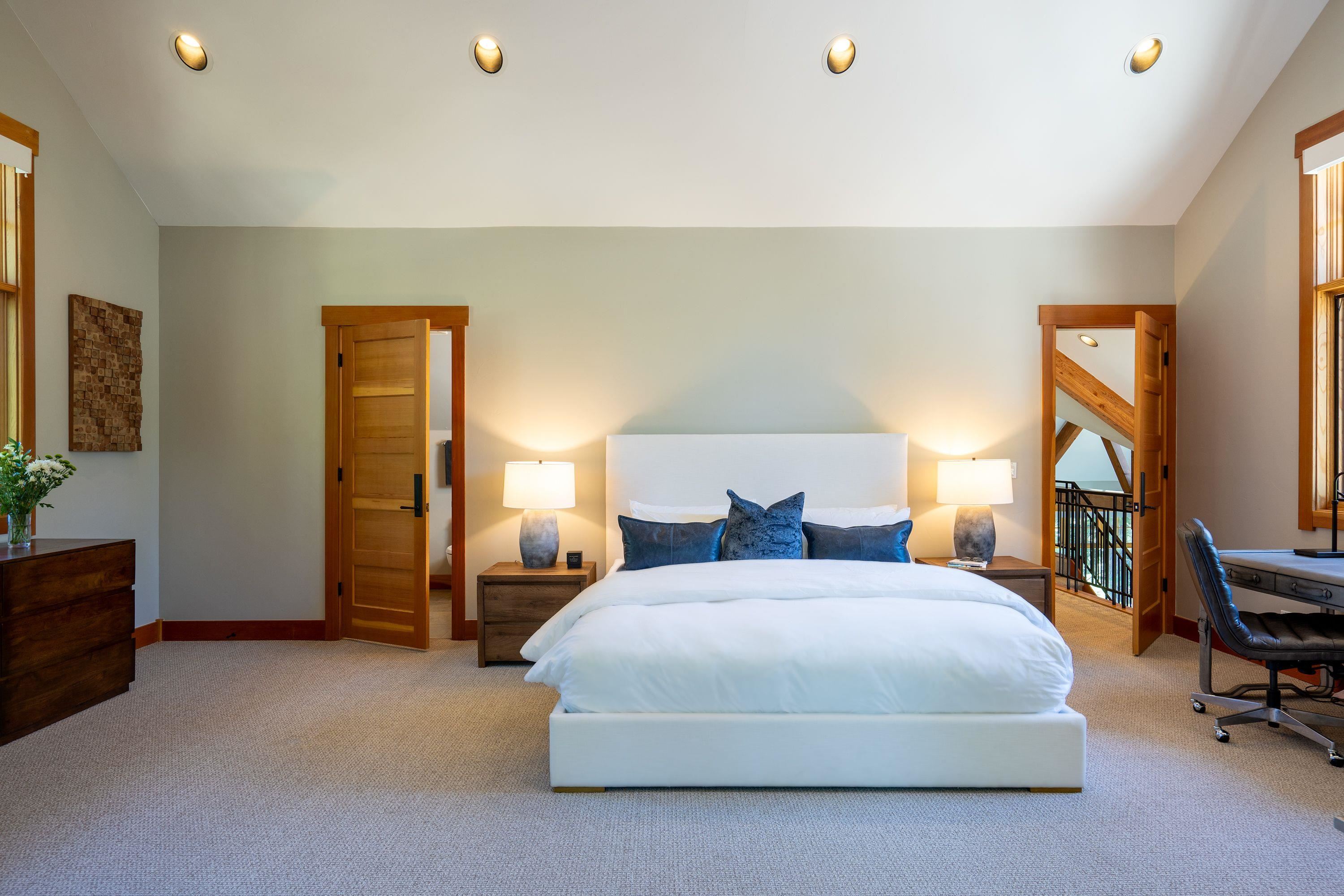 1723 Grouse Ridge Road Truckee, CA 96161 - Photo 17 of 27 a bedroom with a bed a dresser and a potted plant