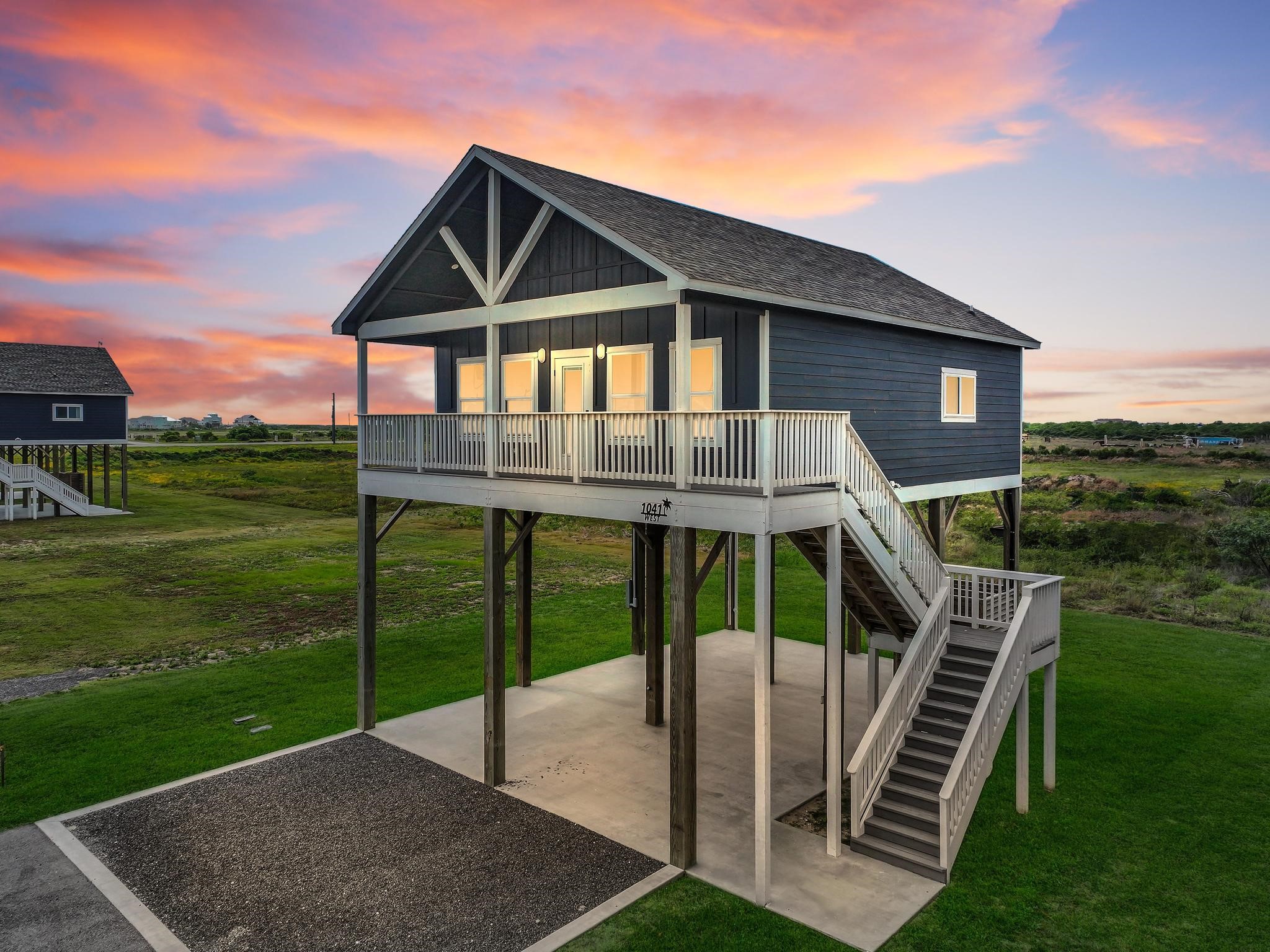 a front view of a house with a yard table and chairs