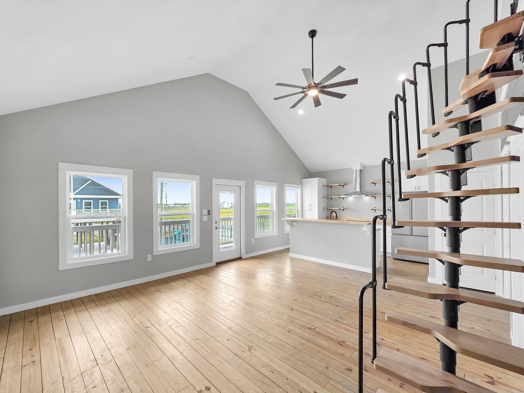1041 Sunset Circle Crystal Beach, TX 77650 - Photo 20 of 45 wooden floor in an empty room with a window