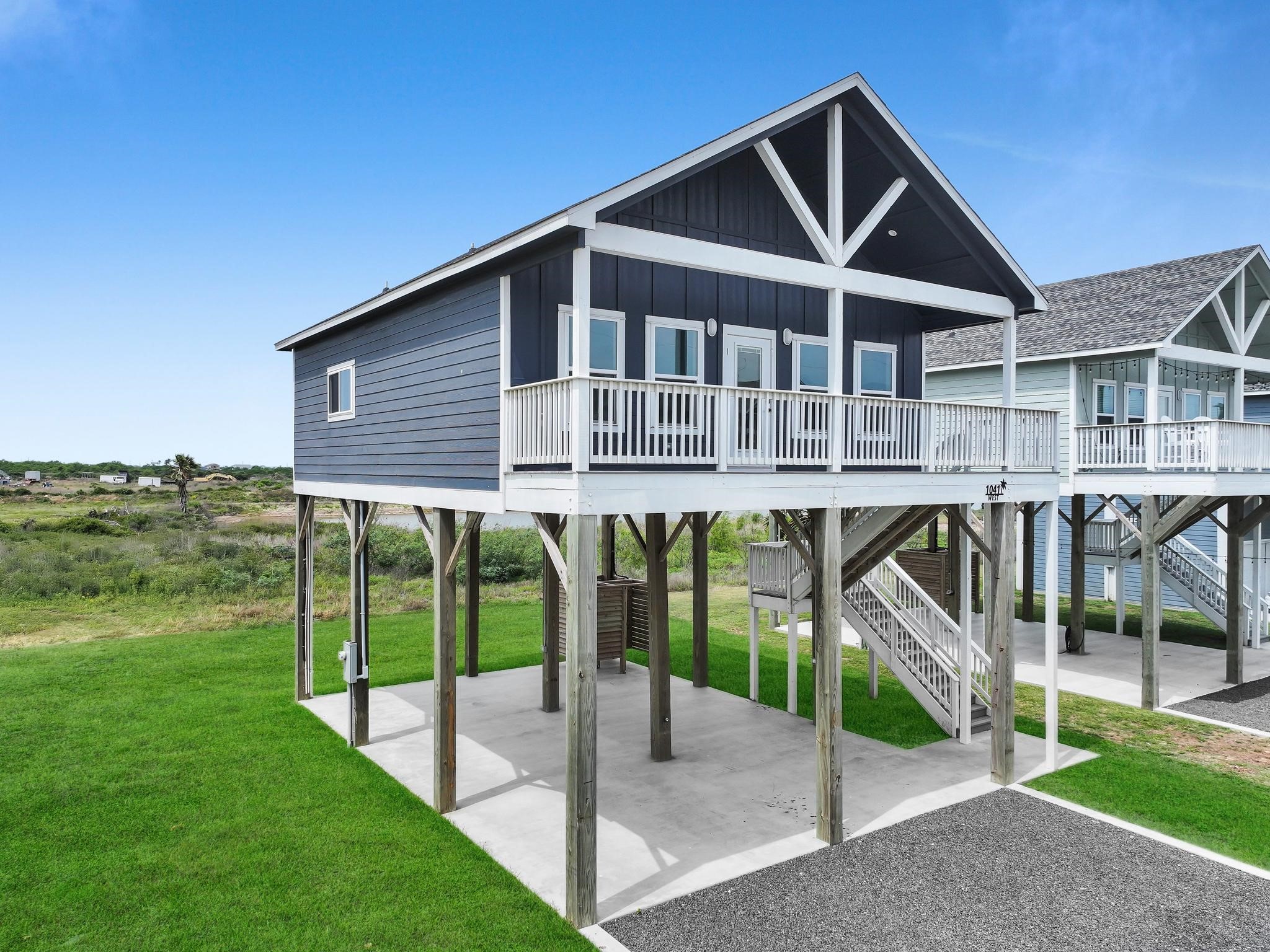 1041 Sunset Circle Crystal Beach, TX 77650 - Photo 2 of 45 a porch with a yard
