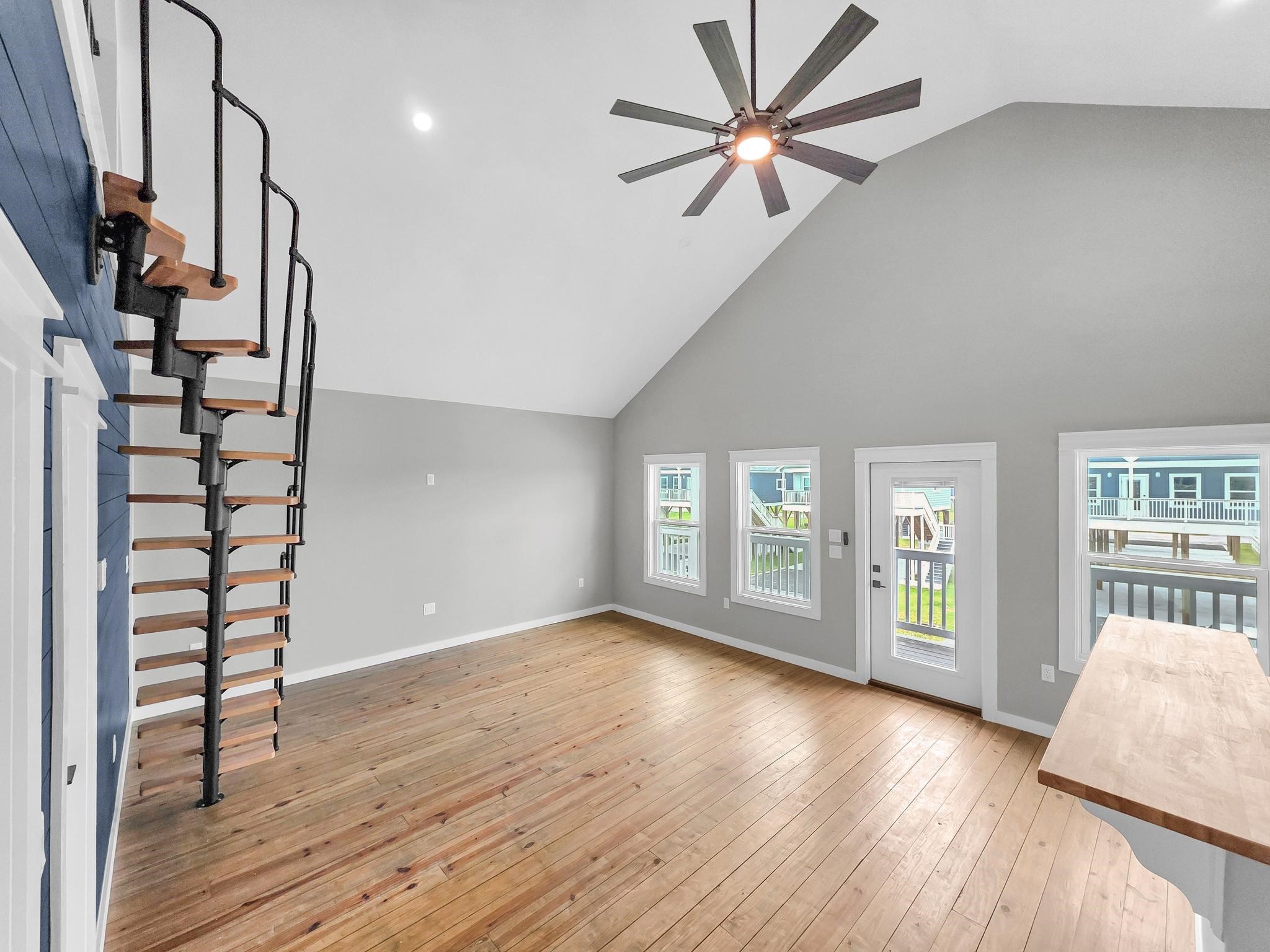 1041 Sunset Circle Crystal Beach, TX 77650 - Photo 21 of 45 wooden floor in an empty room with a window
