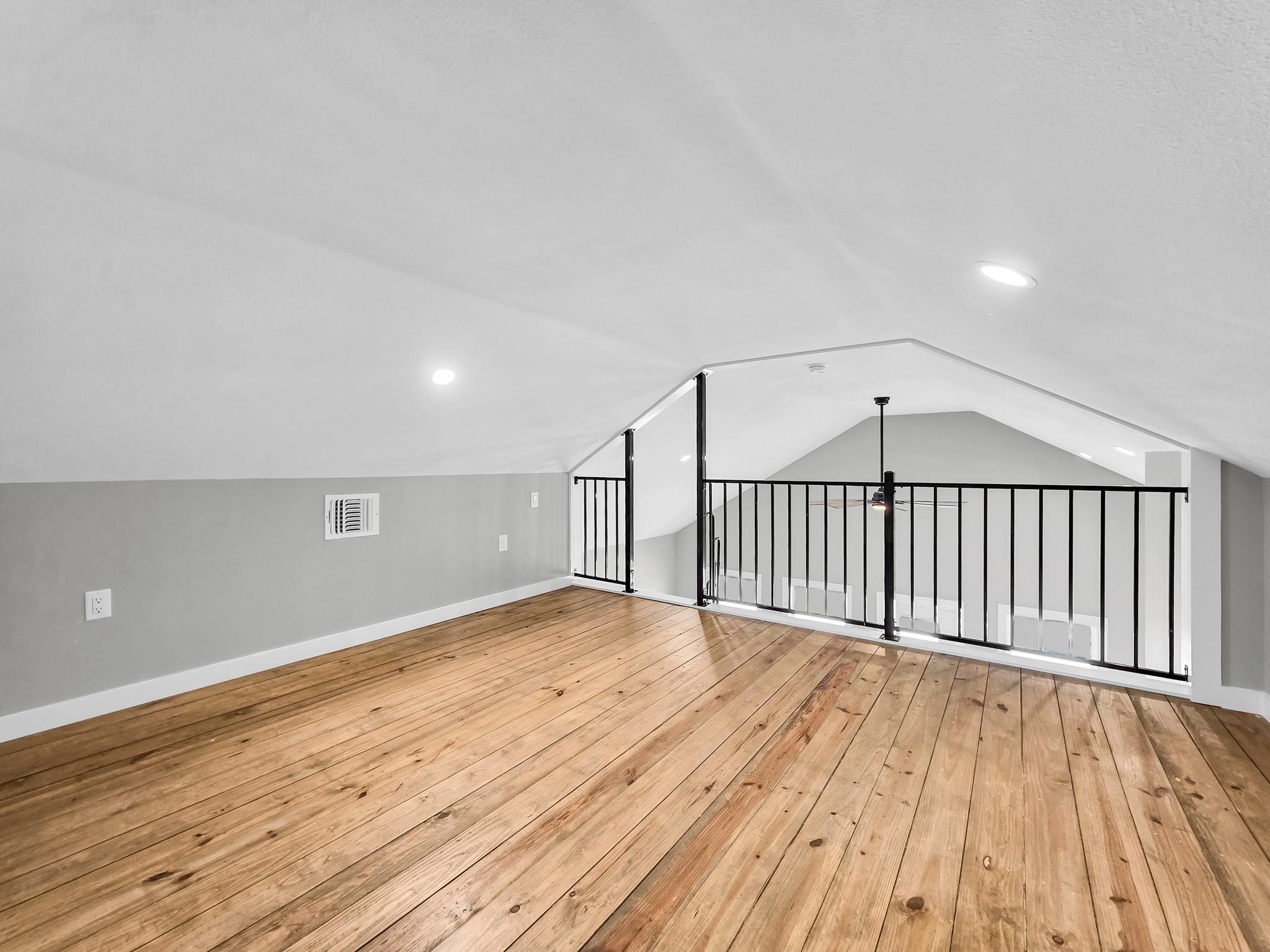1041 Sunset Circle Crystal Beach, TX 77650 - Photo 23 of 45 a view of an empty room with wooden floor