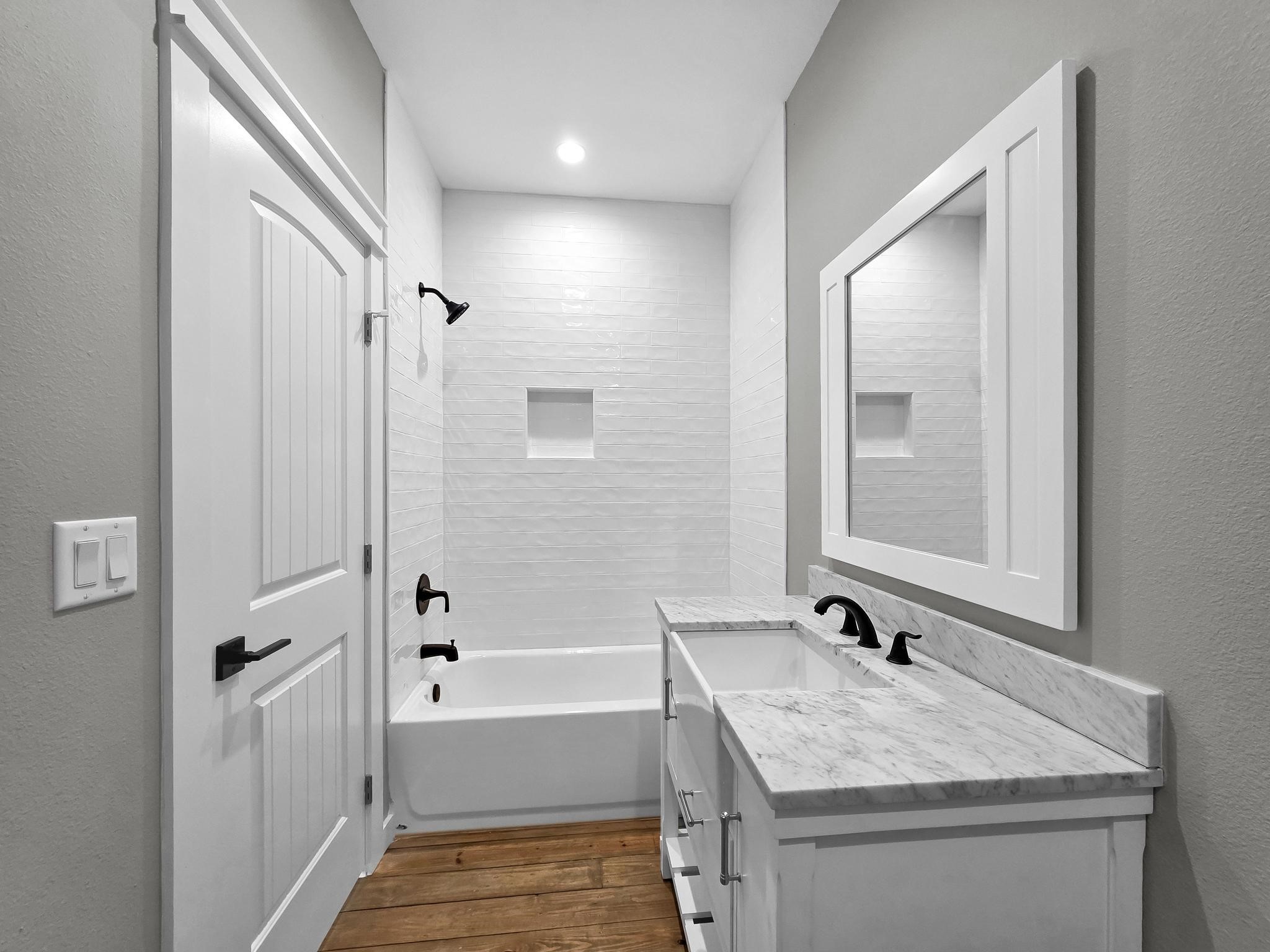 1041 Sunset Circle Crystal Beach, TX 77650 - Photo 26 of 45 a bathroom with a tub sink and mirror