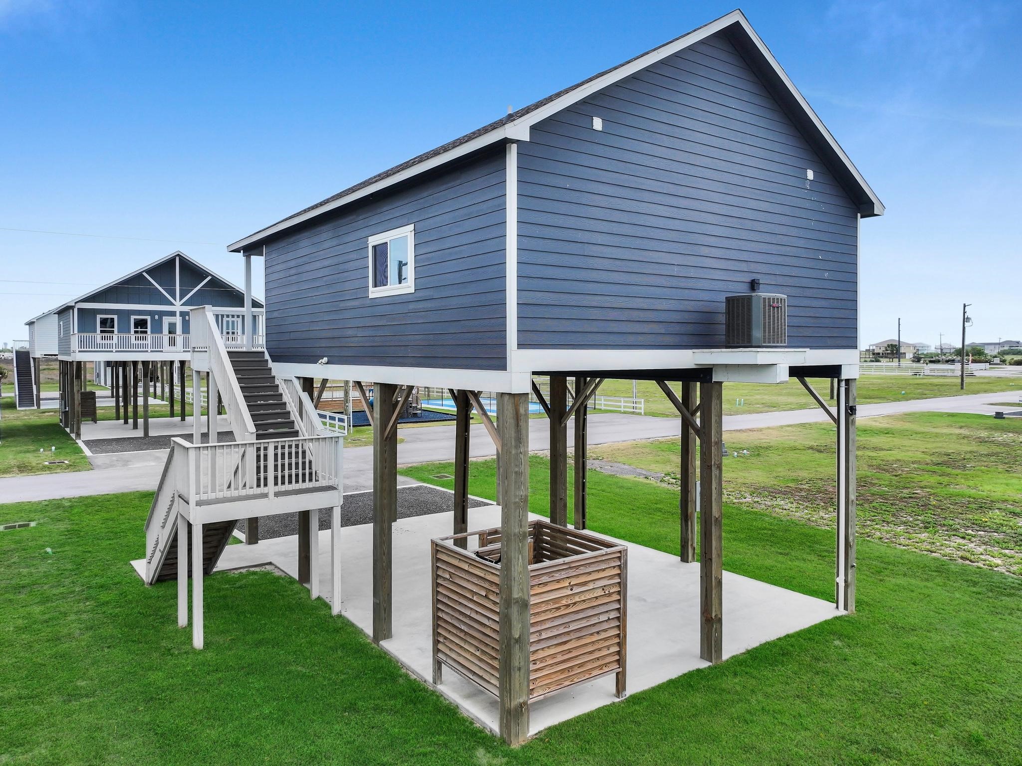 1041 Sunset Circle Crystal Beach, TX 77650 - Photo 39 of 45 a view of a house with backyard and porch