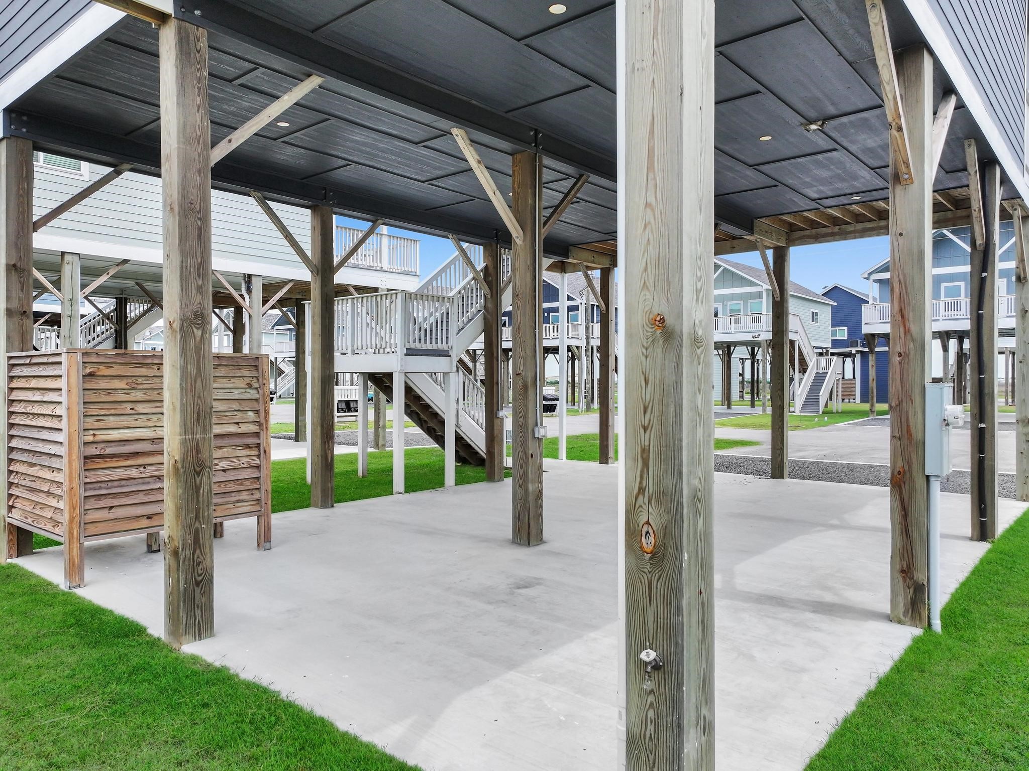 1041 Sunset Circle Crystal Beach, TX 77650 - Photo 42 of 45 a view of a porch with a small yard