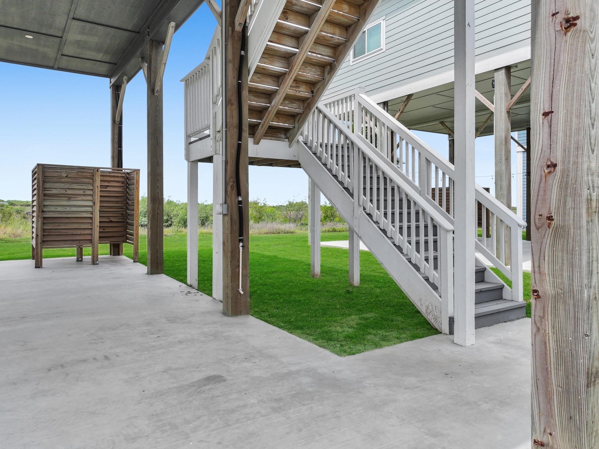 1041 Sunset Circle Crystal Beach, TX 77650 - Photo 45 of 45 a view of an house with a yard and deck