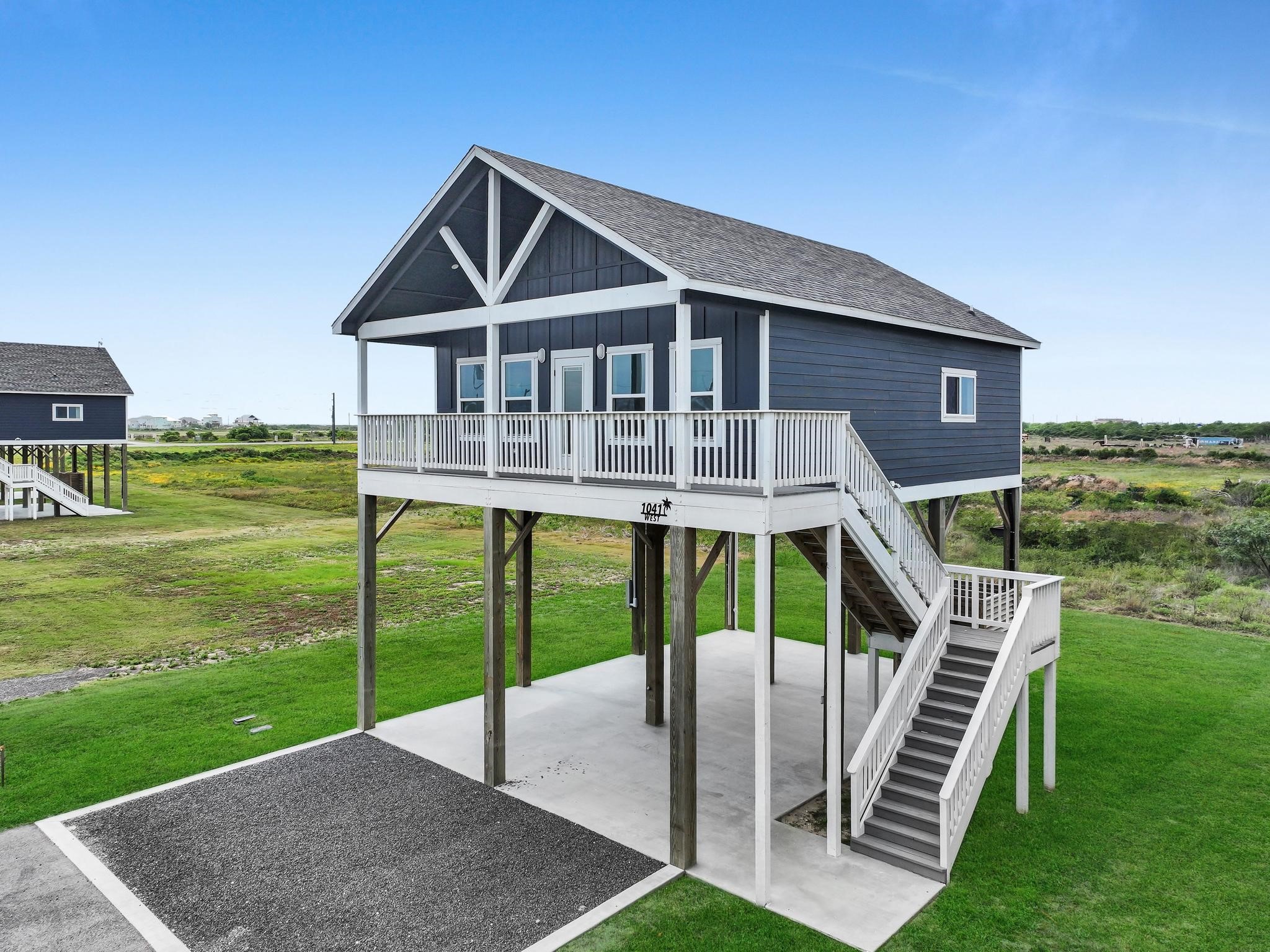 1041 Sunset Circle Crystal Beach, TX 77650 - Photo 5 of 45 a front view of house with garden and deck