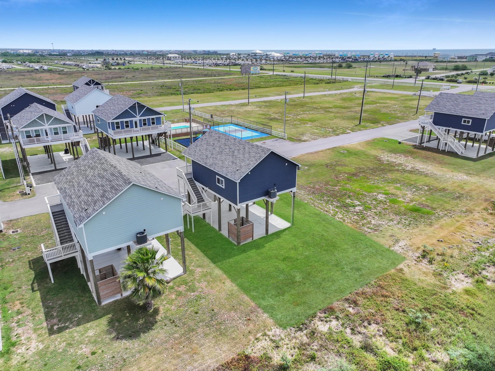 1041 Sunset Circle Crystal Beach, TX 77650 - Photo 6 of 45 a view of a lake with a garden and lake view