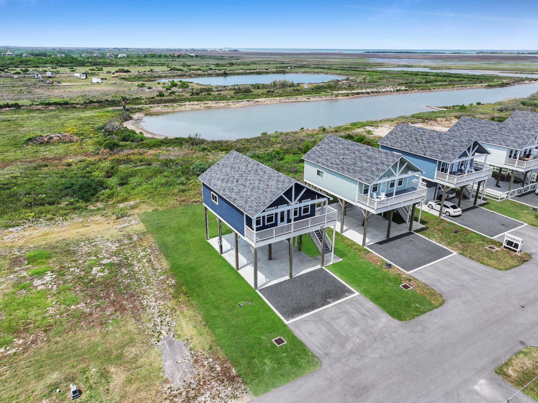 1041 Sunset Circle Crystal Beach, TX 77650 - Photo 7 of 45 an aerial view of a house with big yard