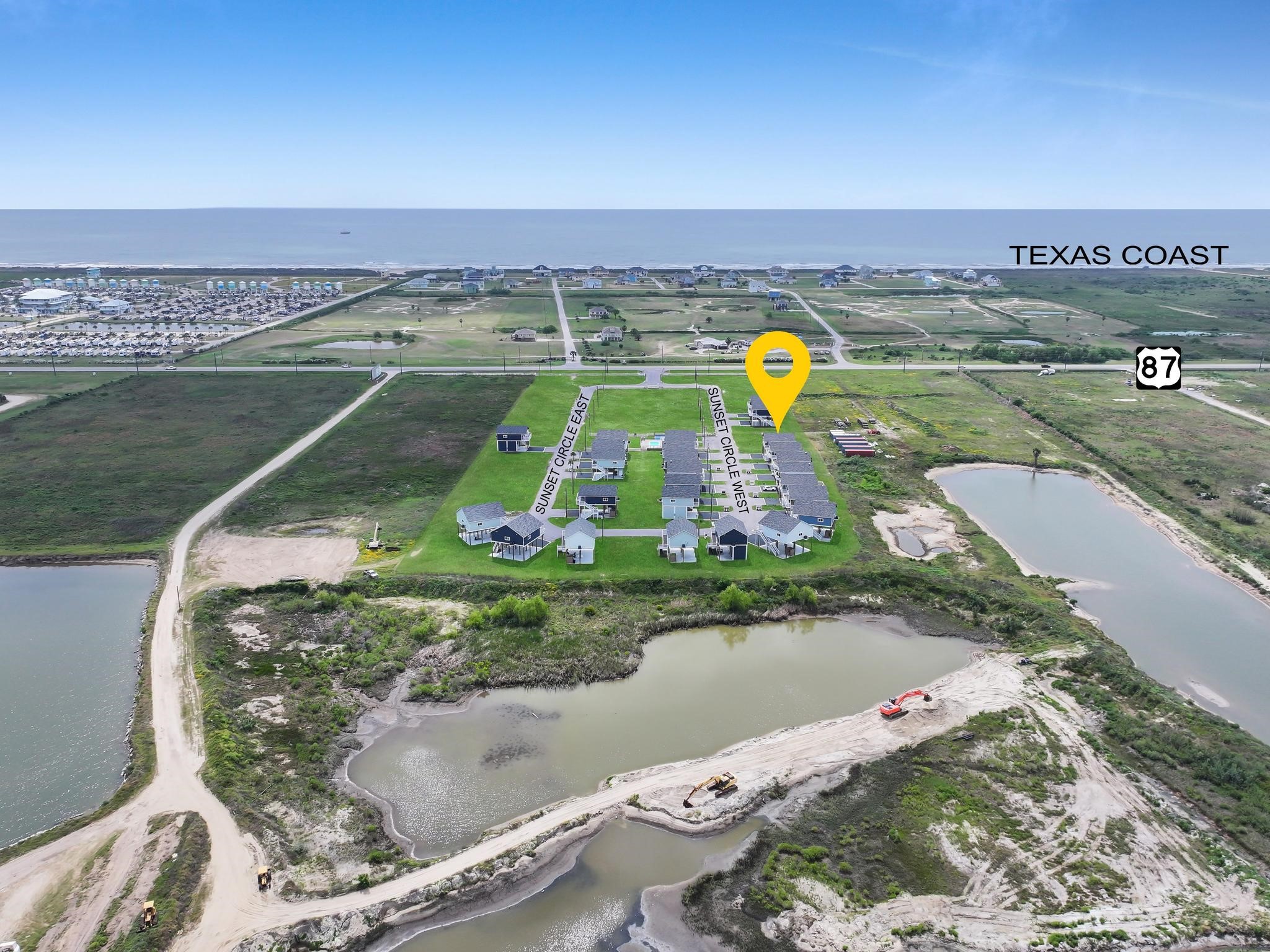 1041 Sunset Circle Crystal Beach, TX 77650 - Photo 10 of 45 a view of a lake with a building in the background