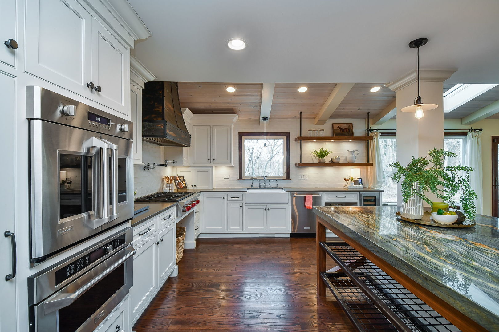 42W420 Campton Hills Road Elburn, IL 60119 - Photo 14 of 58 a kitchen with a sink stainless steel appliances and wooden floor