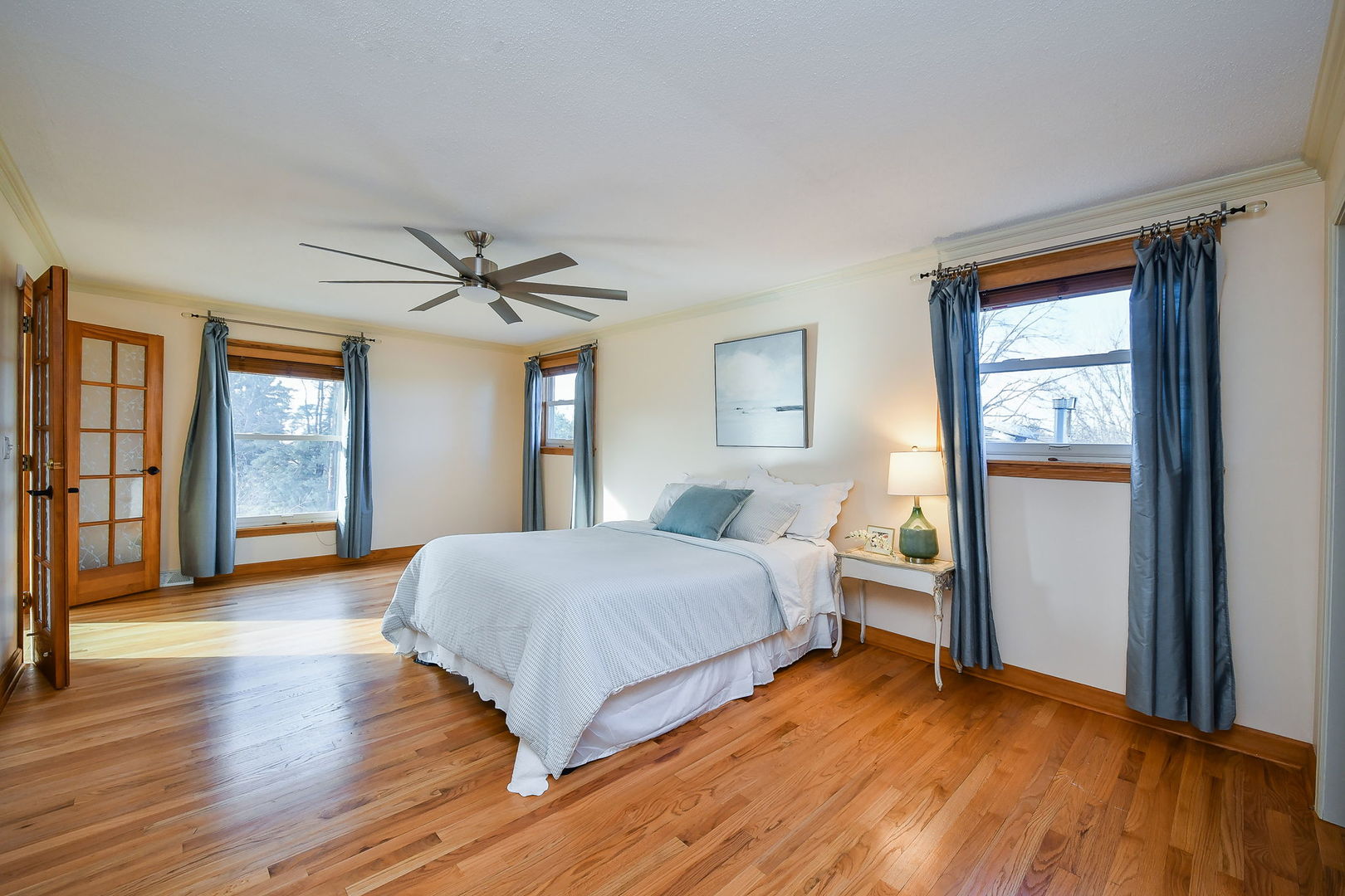 42W420 Campton Hills Road Elburn, IL 60119 - Photo 22 of 58 a spacious bedroom with a bed and wooden floor