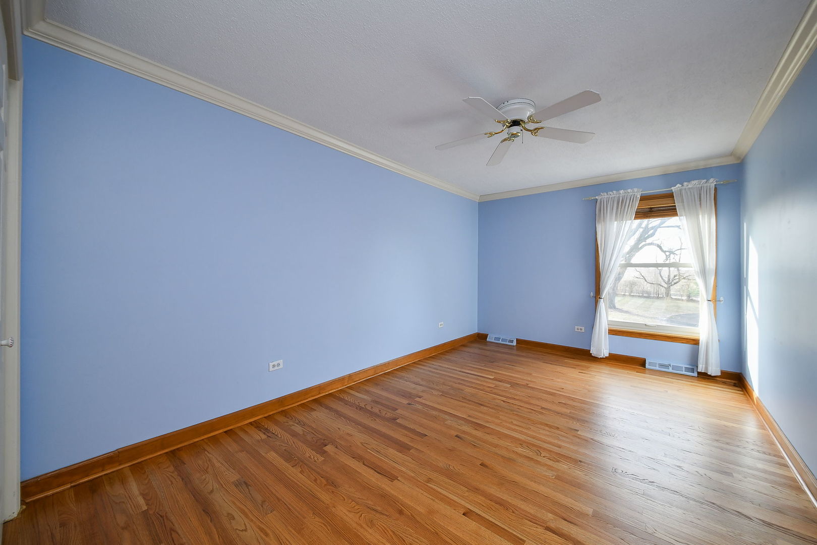 42W420 Campton Hills Road Elburn, IL 60119 - Photo 25 of 58 wooden floor in an empty room with a window
