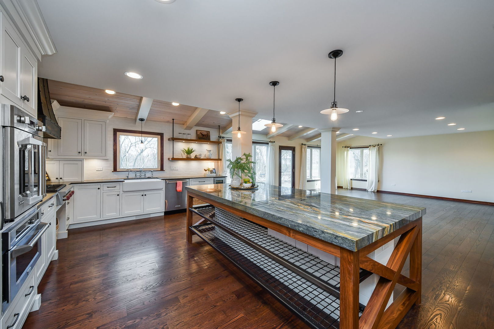 42W420 Campton Hills Road Elburn, IL 60119 - Photo 3 of 58 a kitchen with stainless steel appliances kitchen island granite countertop a stove a sink and a wooden floors