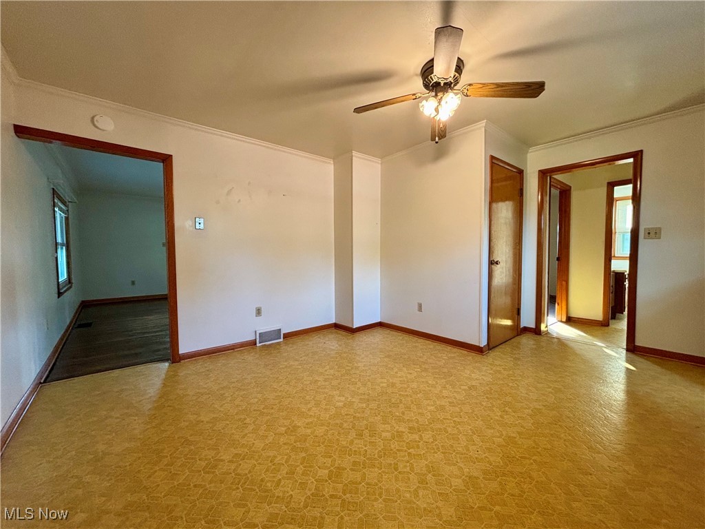 164 Locust Lane Follansbee, WV 26037 - Photo 8 of 19 Spare room with plenty of natural light, crown molding, and ceiling fan