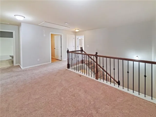 a view of a hallway with closet area