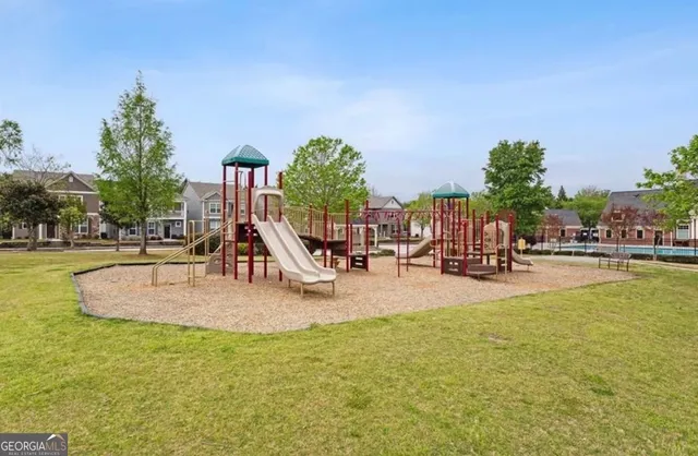 a view of a swimming pool with an outdoor space and seating area