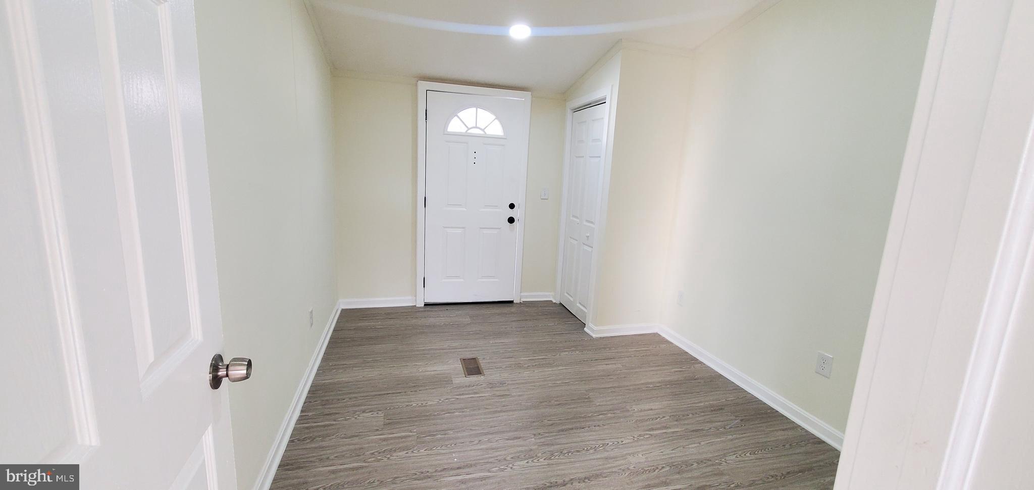 35-1125 Old Philadelphia Road Aberdeen, MD 21001 - Photo 15 of 18 a view of a hallway with wooden floor