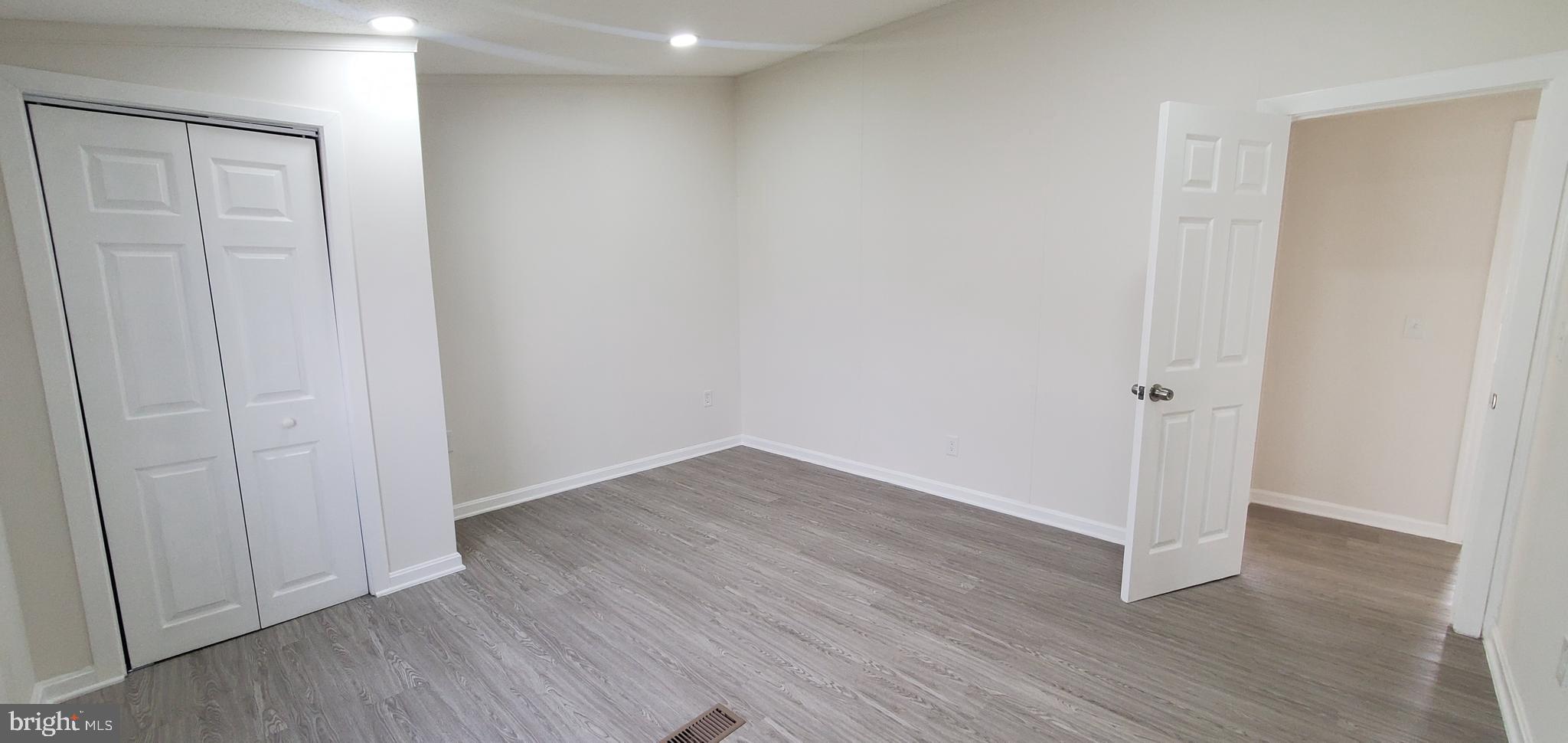 35-1125 Old Philadelphia Road Aberdeen, MD 21001 - Photo 17 of 18 a view of an empty room with wooden floor
