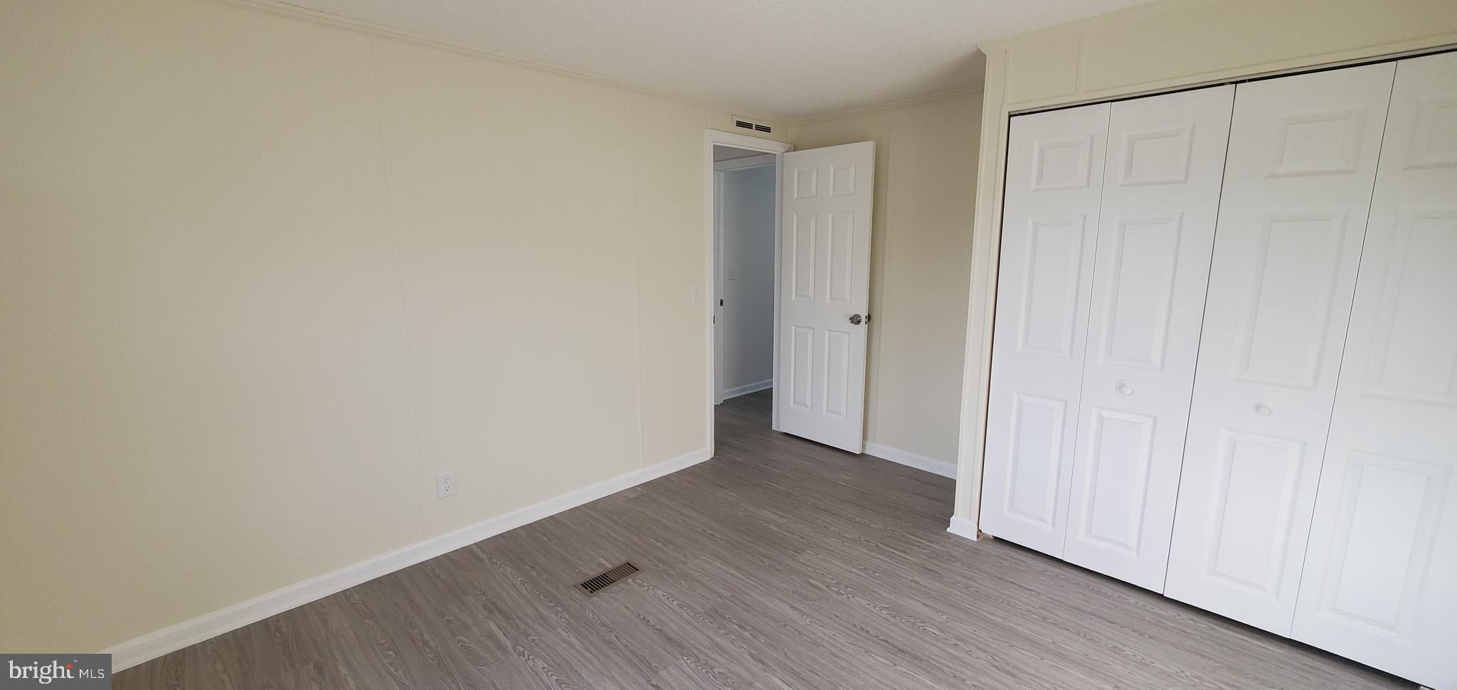 35-1125 Old Philadelphia Road Aberdeen, MD 21001 - Photo 18 of 18 a view of an empty room with wooden floor