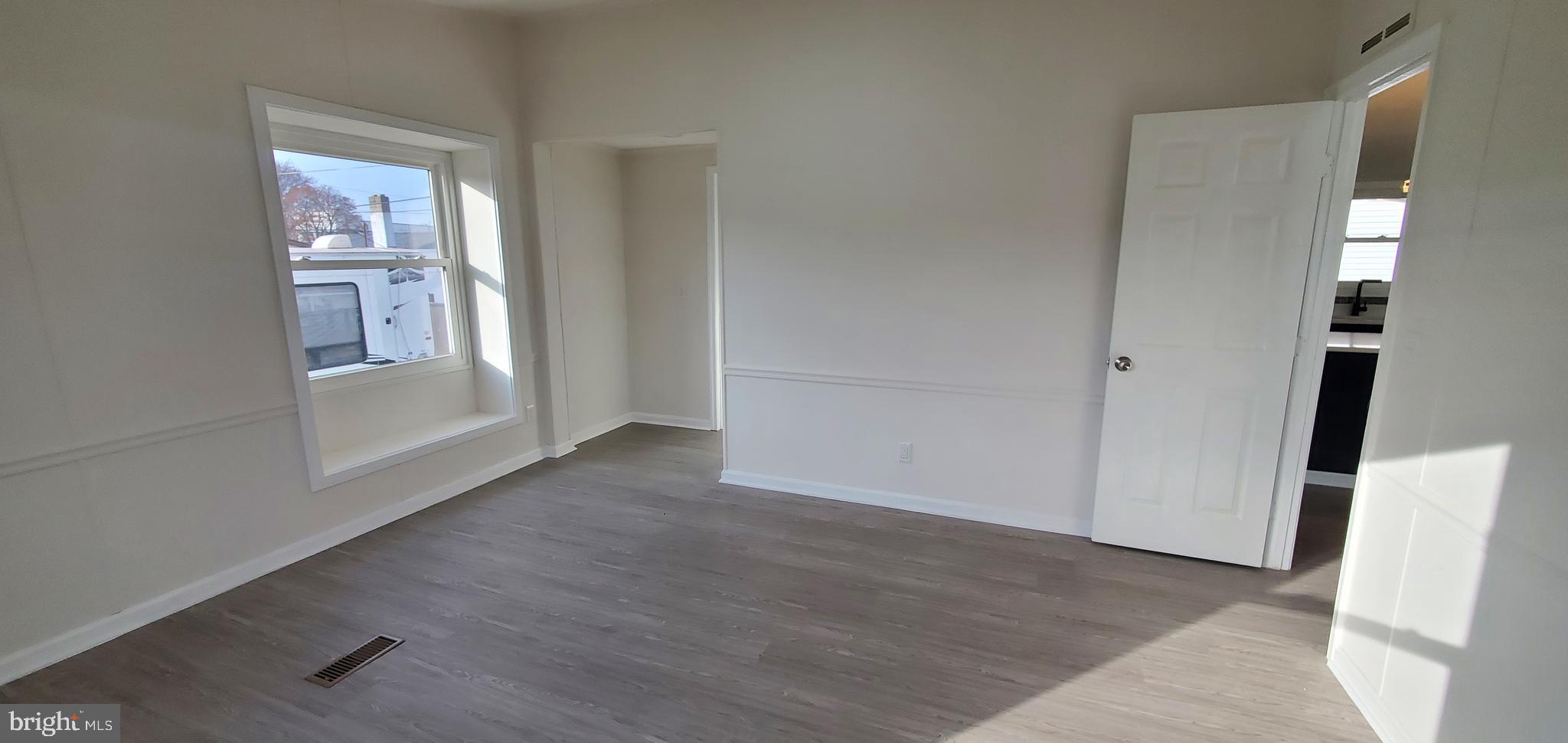 35-1125 Old Philadelphia Road Aberdeen, MD 21001 - Photo 10 of 18 an empty room with wooden floor and windows