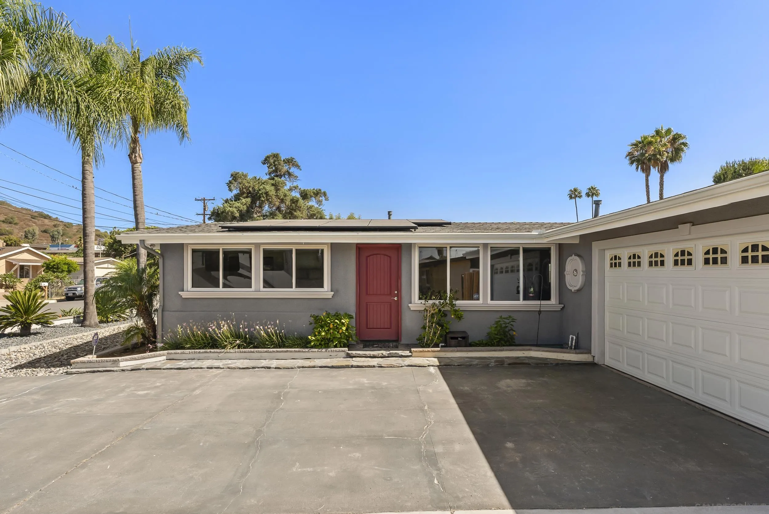 13425 Powers Road Poway, CA 92064 - Photo 1 of 35 a front view of a house with garden