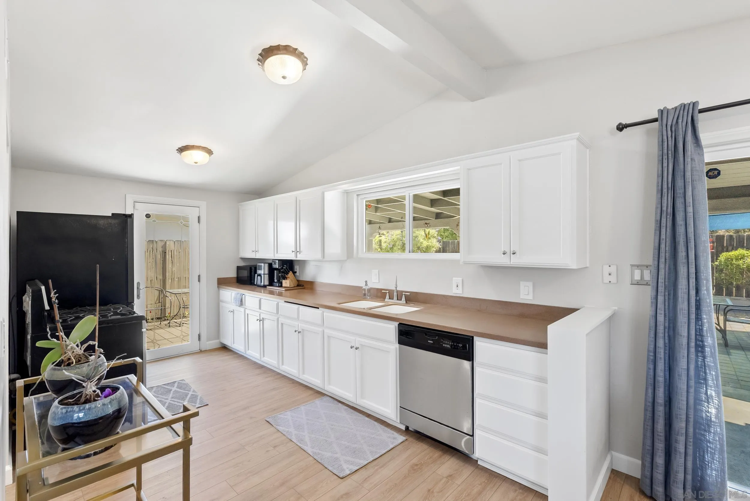 13425 Powers Road Poway, CA 92064 - Photo 11 of 35 a kitchen with a sink cabinets and window