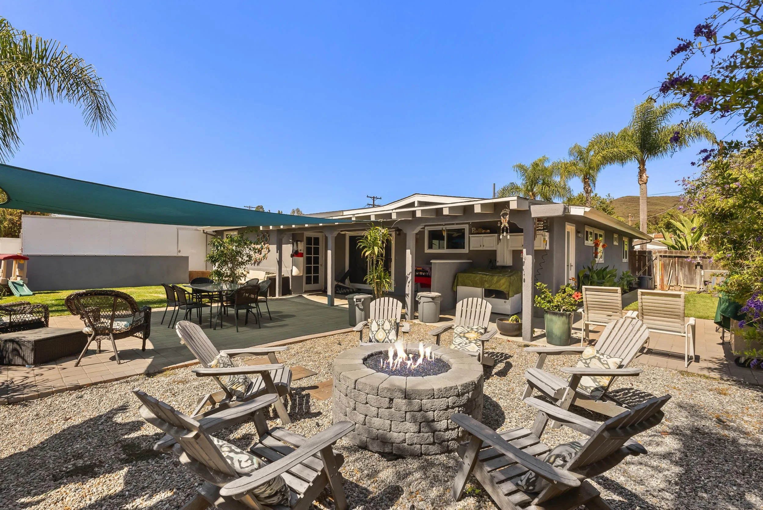 13425 Powers Road Poway, CA 92064 - Photo 25 of 35 a view of a patio with table and chairs and potted plants