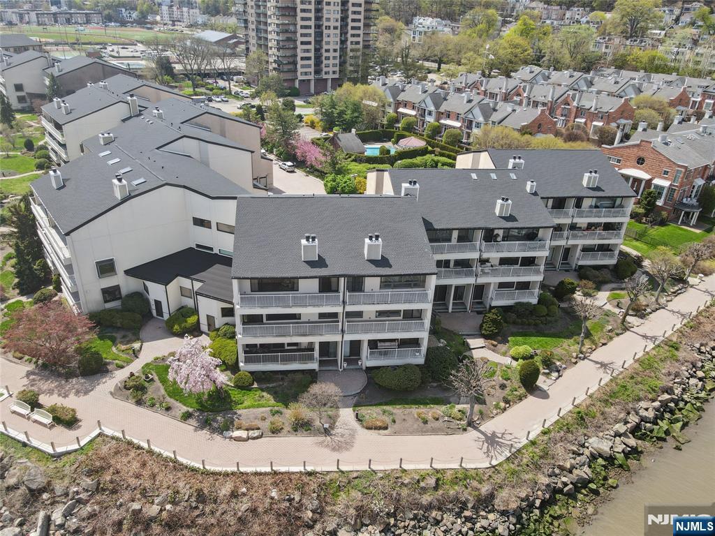 1225 River Road, Unit 4D Edgewater, NJ 07020 - Photo 40 of 47 an aerial view of a house with a yard and lake view