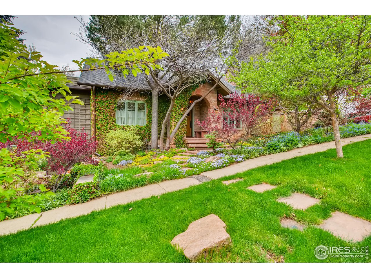 2123 4th Street Boulder, CO 80302 - Photo 1 of 40 a view of an house with backyard space and garden