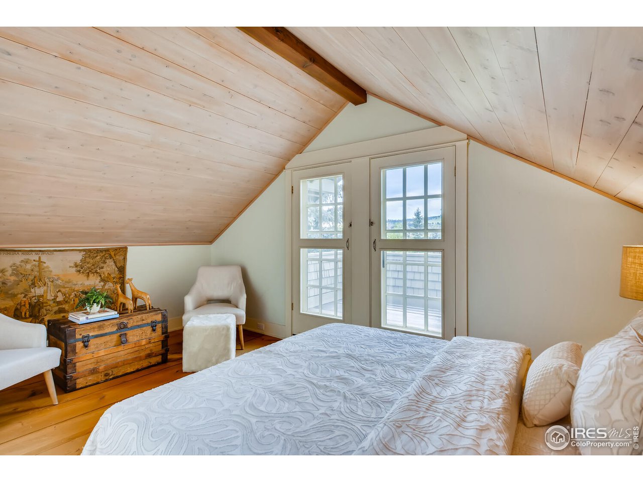 2123 4th Street Boulder, CO 80302 - Photo 15 of 40 a bedroom with a bed next to a window