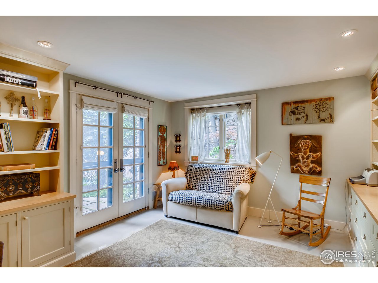 2123 4th Street Boulder, CO 80302 - Photo 18 of 40 a living room with furniture and a window