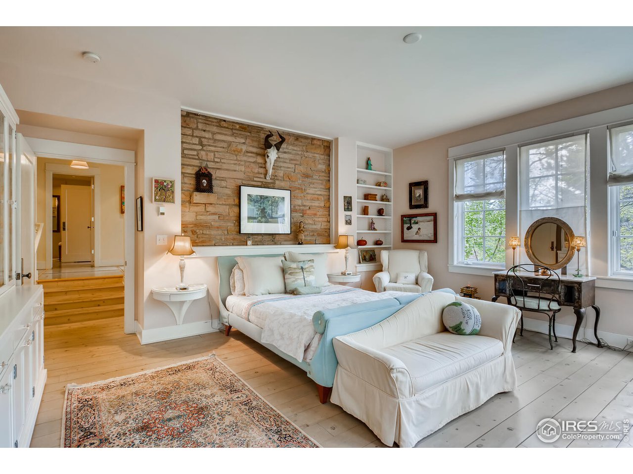 2123 4th Street Boulder, CO 80302 - Photo 20 of 40 a living room with furniture and a fireplace