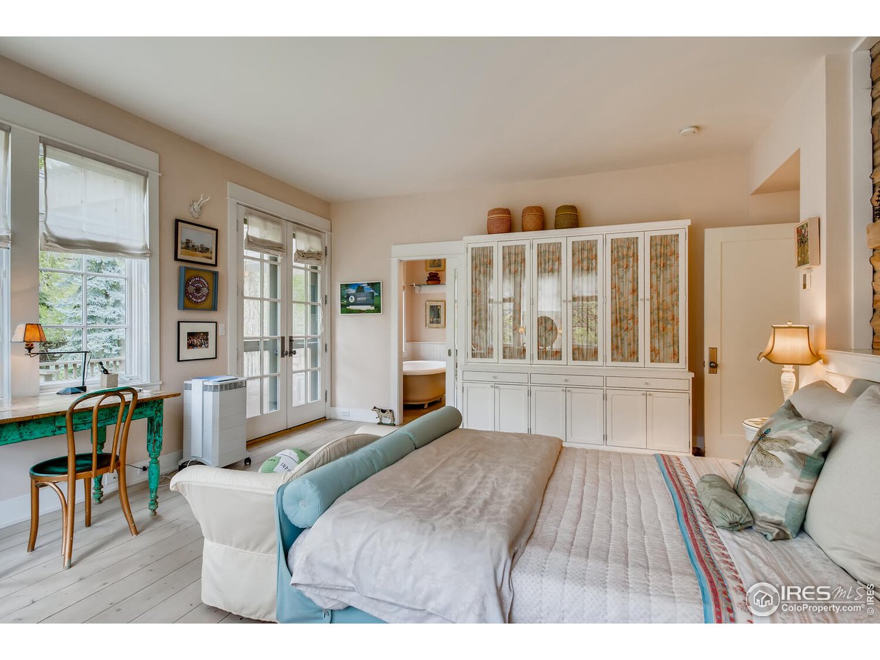 2123 4th Street Boulder, CO 80302 - Photo 21 of 40 a bedroom with furniture and a large window