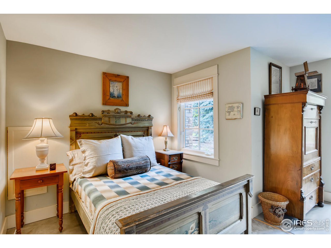 2123 4th Street Boulder, CO 80302 - Photo 24 of 40 a bedroom with a bed and wooden floor