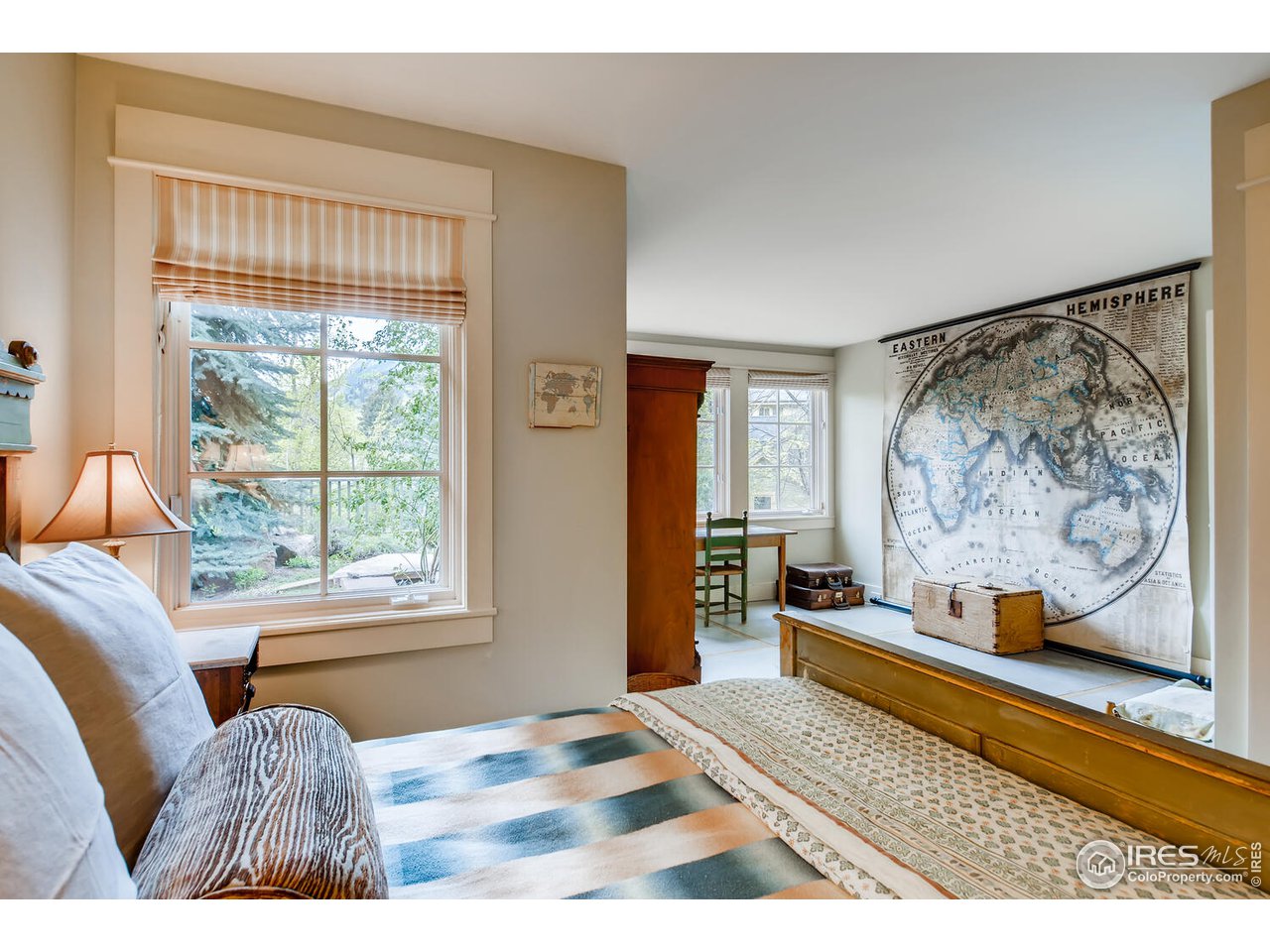 2123 4th Street Boulder, CO 80302 - Photo 25 of 40 a bedroom with furniture and a window