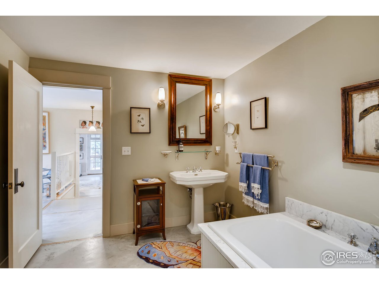 2123 4th Street Boulder, CO 80302 - Photo 28 of 40 a bathroom with a sink a mirror and a toilet