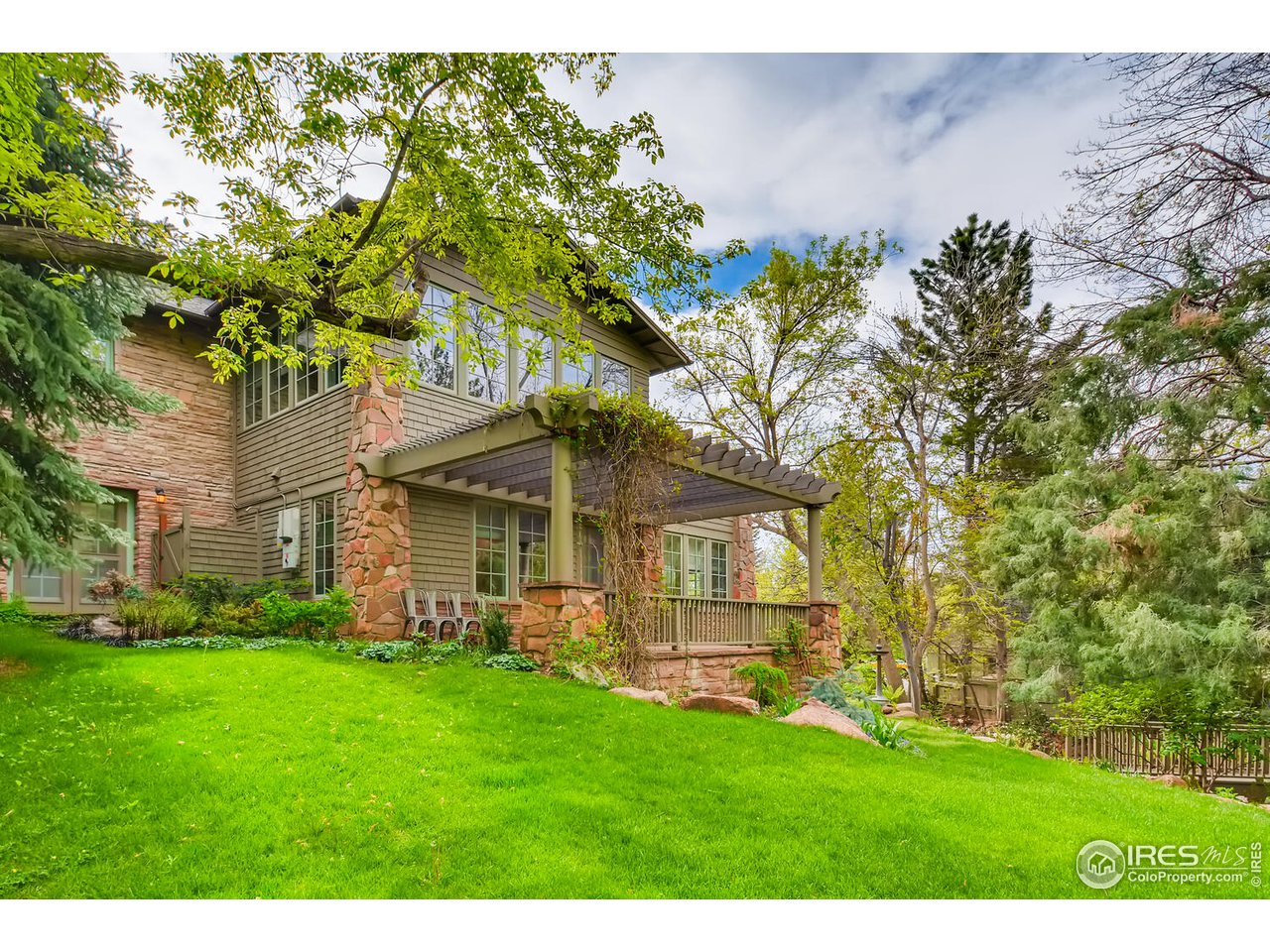 2123 4th Street Boulder, CO 80302 - Photo 38 of 40 a front view of a house with a garden