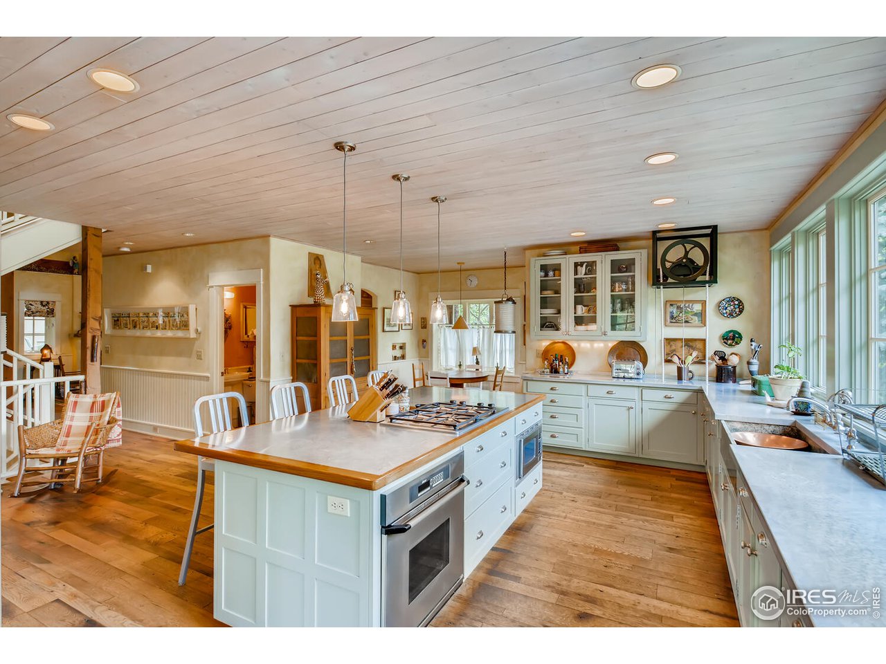 2123 4th Street Boulder, CO 80302 - Photo 10 of 40 a kitchen with kitchen island granite countertop lots of counter top space