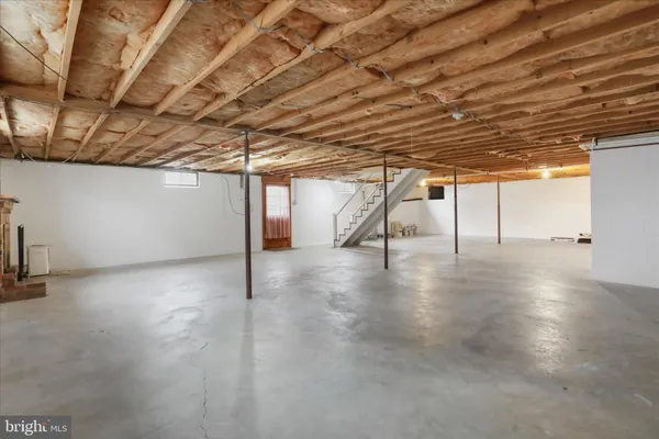 a view of a room with wooden walls