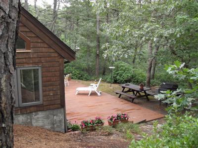160 Old Long Pond Road Wellfleet, MA 02667 - Photo 11 of 18 a view of a backyard with sitting area