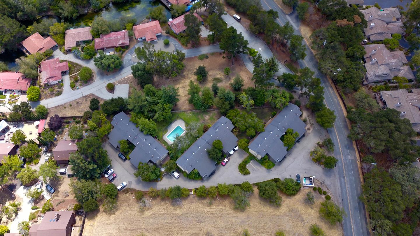 an aerial view of house with swimming pool