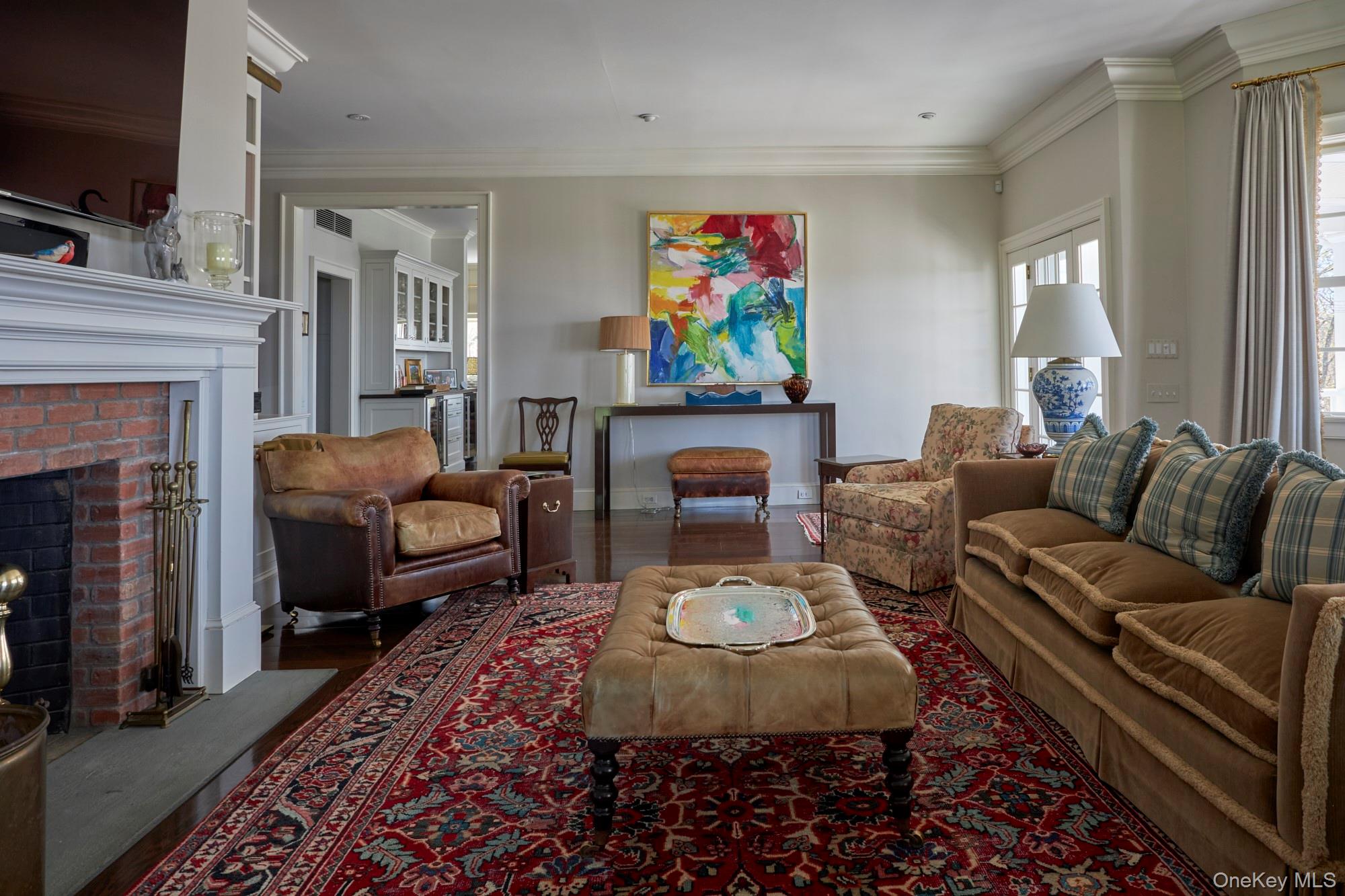 790 Stanford Road Millbrook, NY 12545 - Photo 14 of 50 a living room with furniture a rug and a fireplace