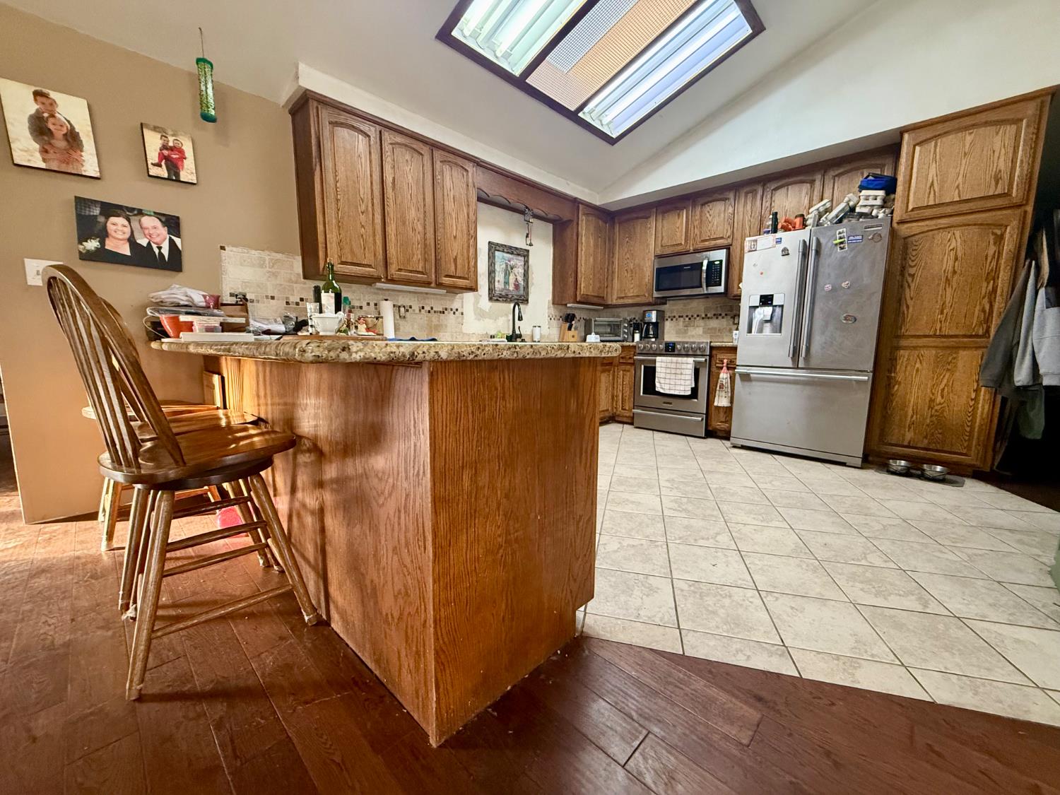 3536 Burson Road Valley Springs, CA 95252 - Photo 19 of 91 a kitchen with stainless steel appliances granite countertop a refrigerator and a stove top oven