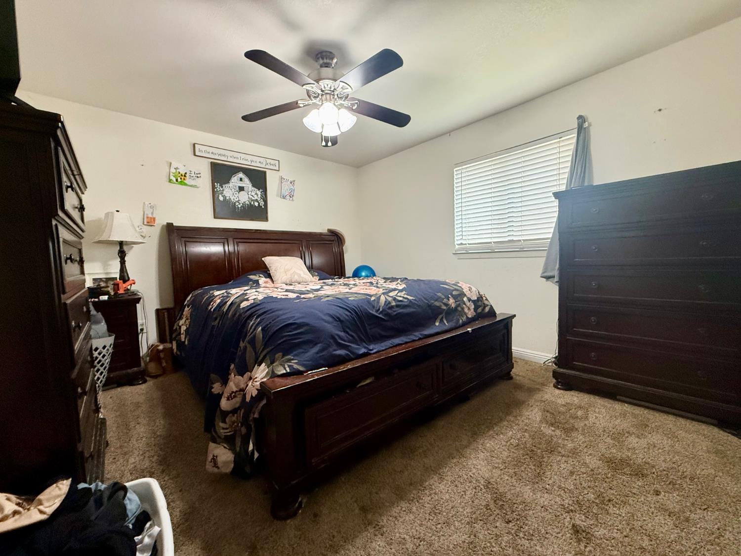 3536 Burson Road Valley Springs, CA 95252 - Photo 37 of 91 a spacious bedroom with a bed and a chandelier