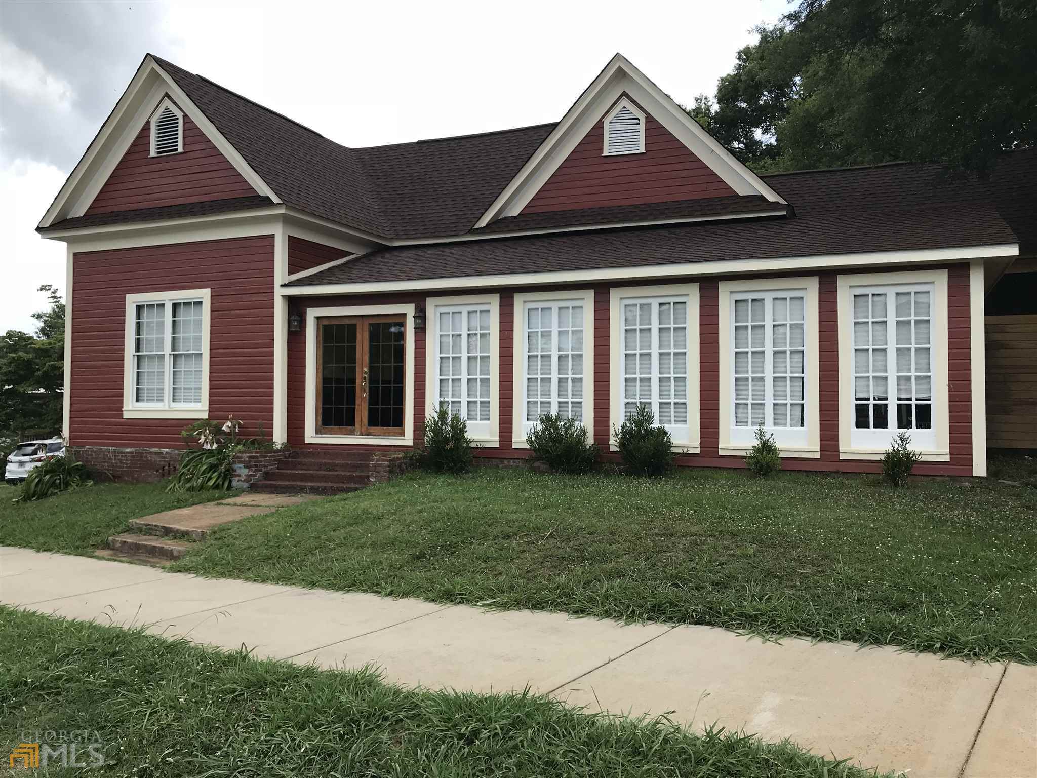 12 Coral Avenue Southwest Rome, GA 30161 - Photo 1 of 1 a front view of a house with a yard