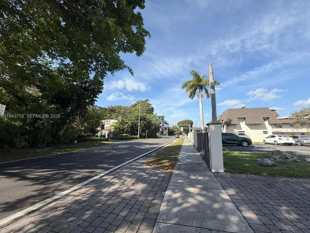 a view of a street with cars