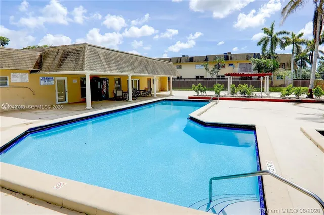 a view of a building with a swimming pool