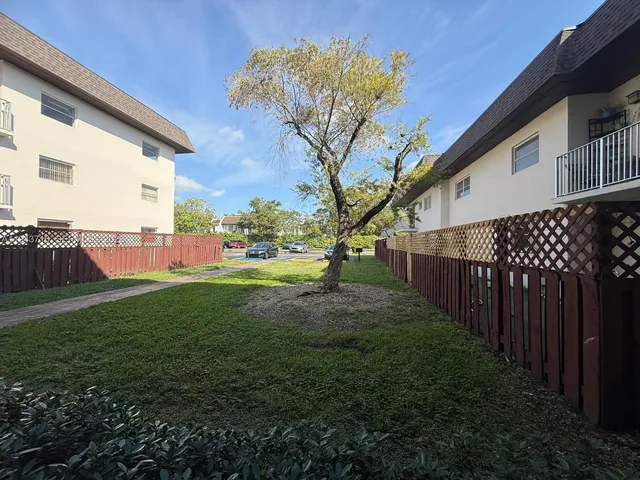a view of backyard with green space